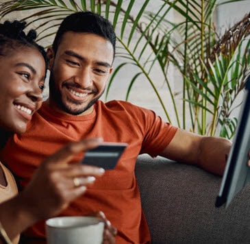 A person and person looking at a tablet